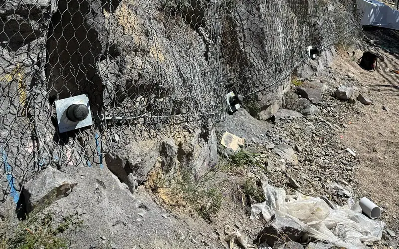 Anchor heads and mesh exposed for maintenance inspection