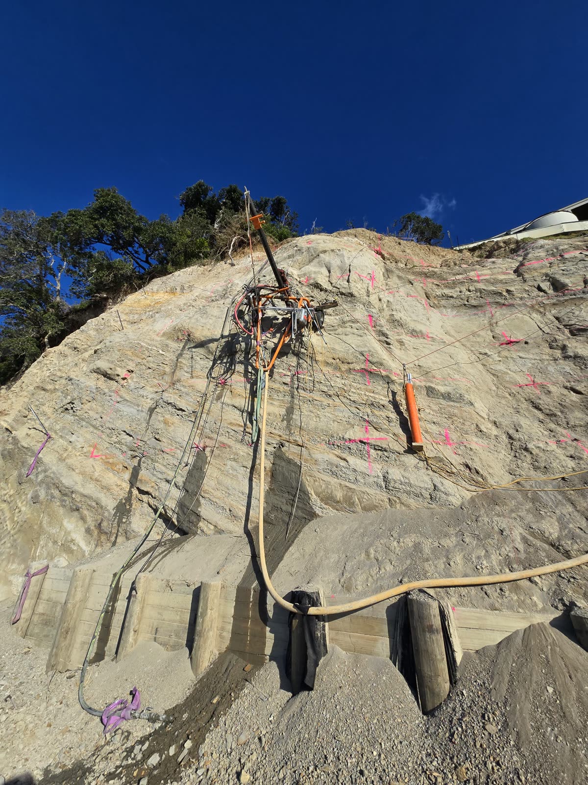 Drilling works on a steep, difficult-access slope