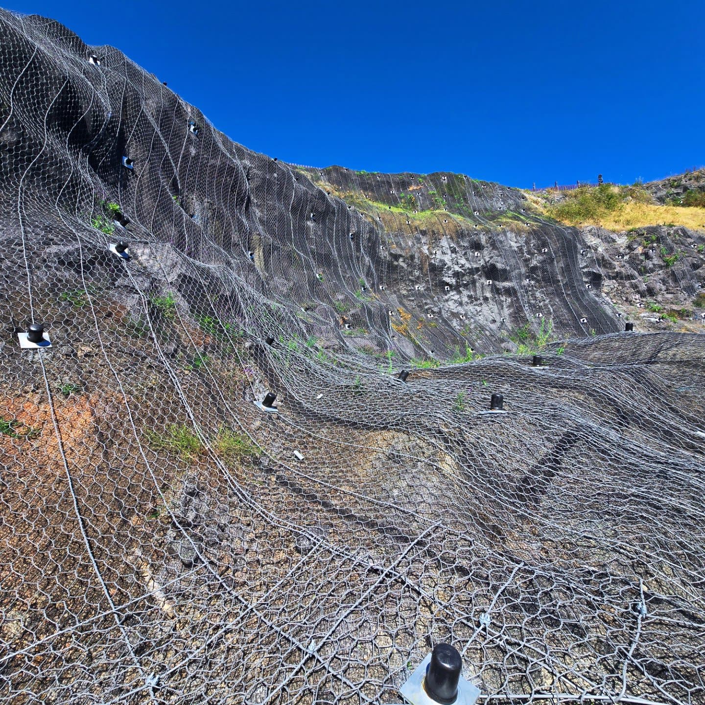 Meshing works across an undulating slope face